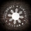LDS Philippines Dumaguete Mission Christmas Ornament laying on a Wooden Background