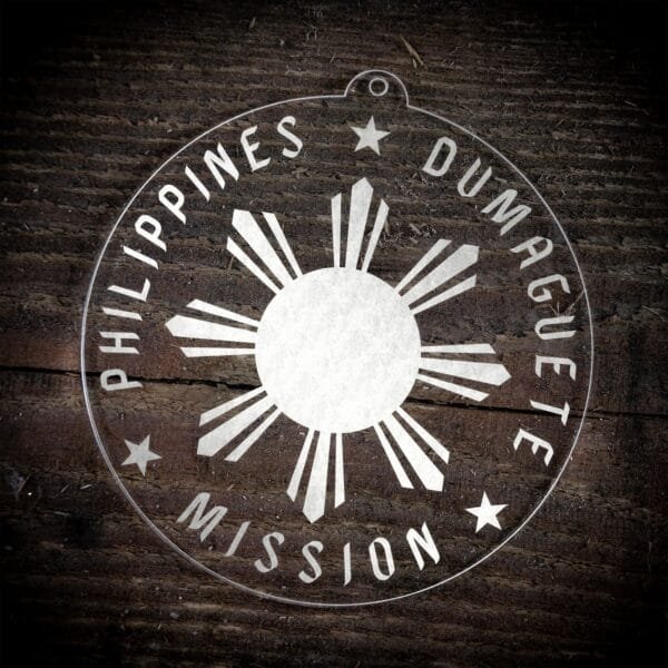 LDS Philippines Dumaguete Mission Christmas Ornament laying on a Wooden Background