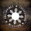 LDS Philippines Tuguegarao Mission Christmas Ornament laying on a Wooden Background