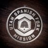 LDS Utah Spanish Fork Mission Christmas Ornament laying on a Wooden Background