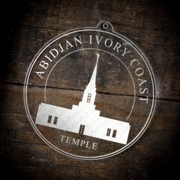 LDS Abidjan Ivory Coast Temple Christmas Ornament laying on a Wooden Background