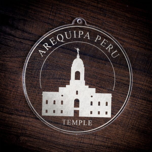LDS Arequipa Peru Temple Christmas Ornament laying on a Wooden Background