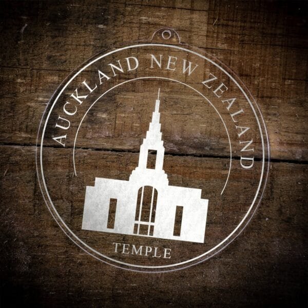 LDS Auckland New Zealand Temple Christmas Ornament laying on a Wooden Background