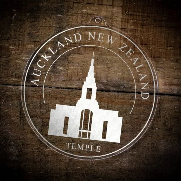 LDS Auckland New Zealand Temple Christmas Ornament laying on a Wooden Background