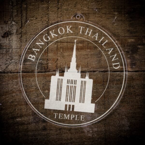 LDS Bangkok Thailand Temple Christmas Ornament laying on a Wooden Background