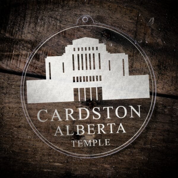 LDS Cardston Alberta Temple Christmas Ornament laying on a Wooden Background