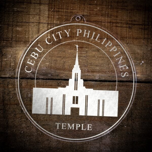LDS Cebu City Philippines Temple Christmas Ornament laying on a Wooden Background