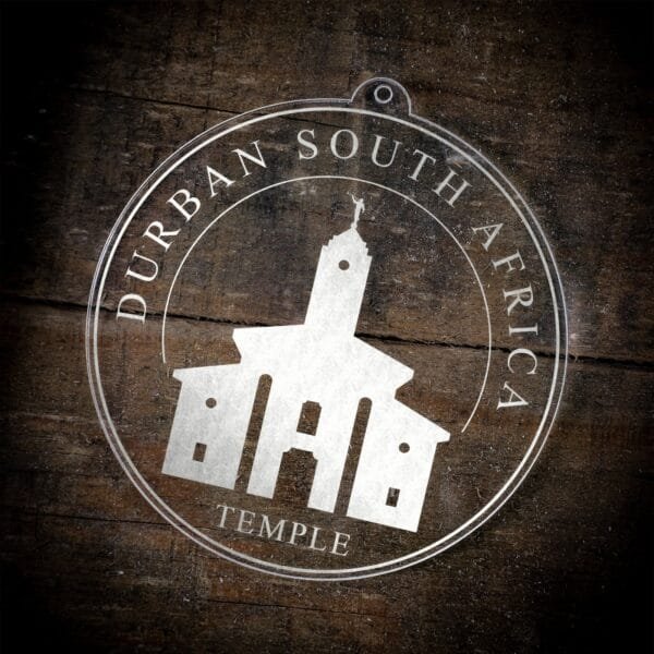 LDS Durban South Africa Temple Christmas Ornament laying on a Wooden Background