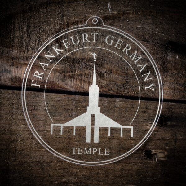 LDS Frankfurt Germany Temple Christmas Ornament laying on a Wooden Background