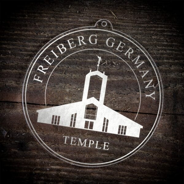 LDS Freiberg Germany Temple Christmas Ornament laying on a Wooden Background