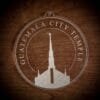 LDS Guatemala City Guatemala Temple Christmas Ornament laying on a Wooden Background