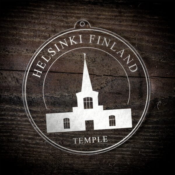 LDS Helsinki Finland Temple Christmas Ornament laying on a Wooden Background