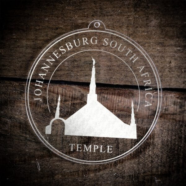 LDS Johannesburg South Africa Temple Christmas Ornament laying on a Wooden Background