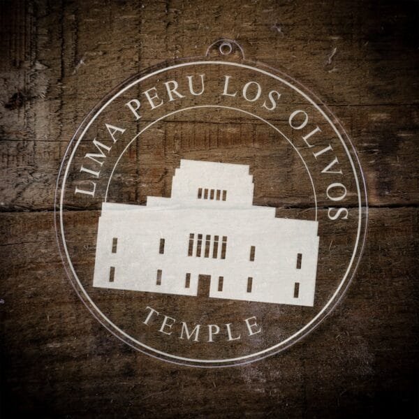 LDS Lima Peru Los Olivos Temple Christmas Ornament laying on a Wooden Background