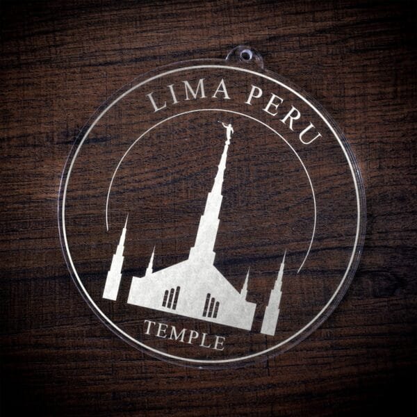 LDS Lima Peru Temple Christmas Ornament laying on a Wooden Background