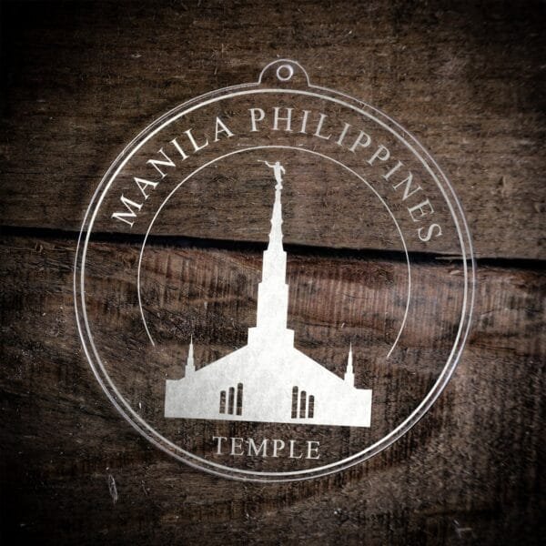 LDS Manila Philippines Temple Christmas Ornament laying on a Wooden Background