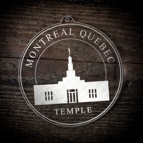 LDS Montreal Quebec Temple Christmas Ornament laying on a Wooden Background
