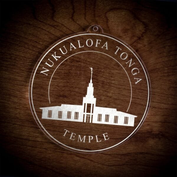 LDS Nukualofa Tonga Temple Christmas Ornament laying on a Wooden Background