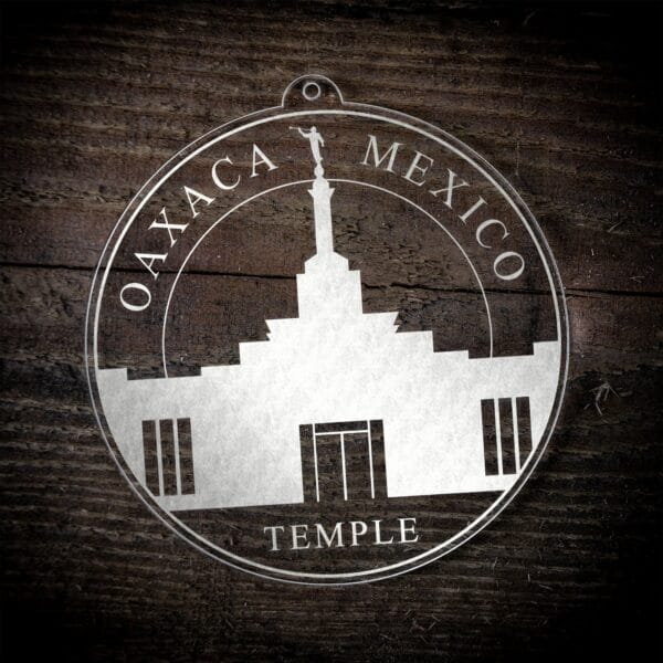 LDS Oaxaca Mexico Temple Christmas Ornament laying on a Wooden Background