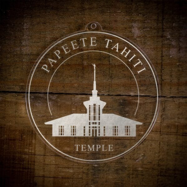 LDS Papeete Tahiti Temple Christmas Ornament laying on a Wooden Background