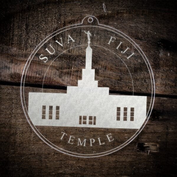 LDS Suva Fiji Temple Christmas Ornament laying on a Wooden Background