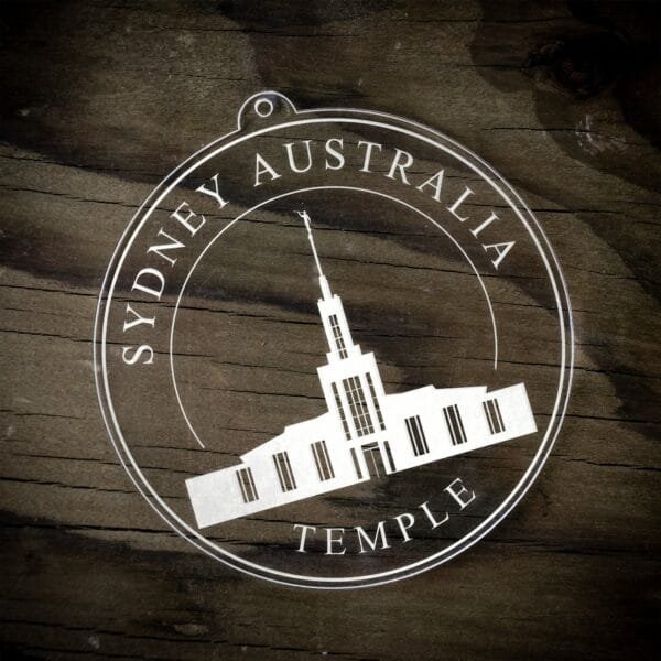 LDS Sydney Australia Temple Christmas Ornament laying on a Wooden Background
