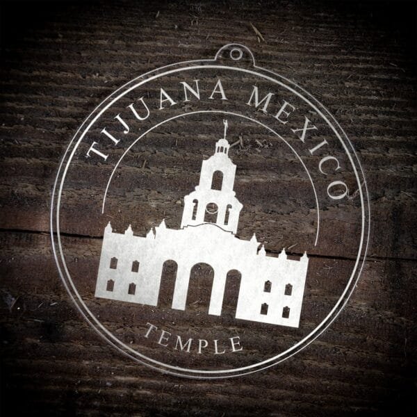 LDS Tijuana Mexico Temple Christmas Ornament laying on a Wooden Background