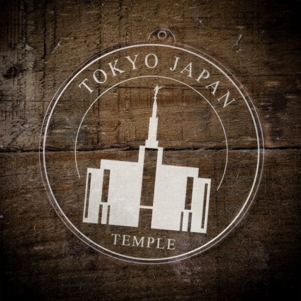 LDS Tokyo Japan Temple Christmas Ornament laying on a Wooden Background