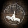 LDS Toronto Ontario Temple Christmas Ornament laying on a Wooden Background