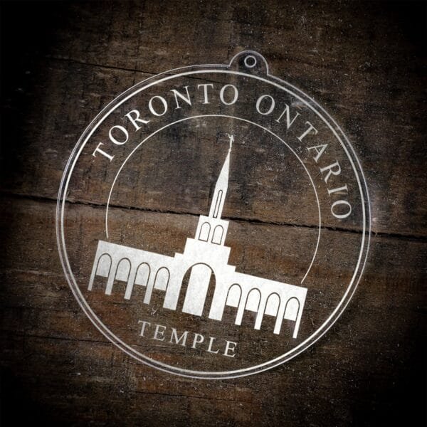 LDS Toronto Ontario Temple Christmas Ornament laying on a Wooden Background