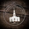 LDS Urdaneta Philippines Temple Christmas Ornament laying on a Wooden Background