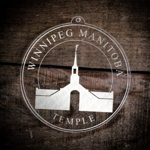 LDS Winnipeg Manitoba Temple Christmas Ornament laying on a Wooden Background